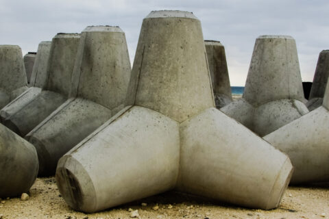 Concrete tetrapods stacked on a shoreline