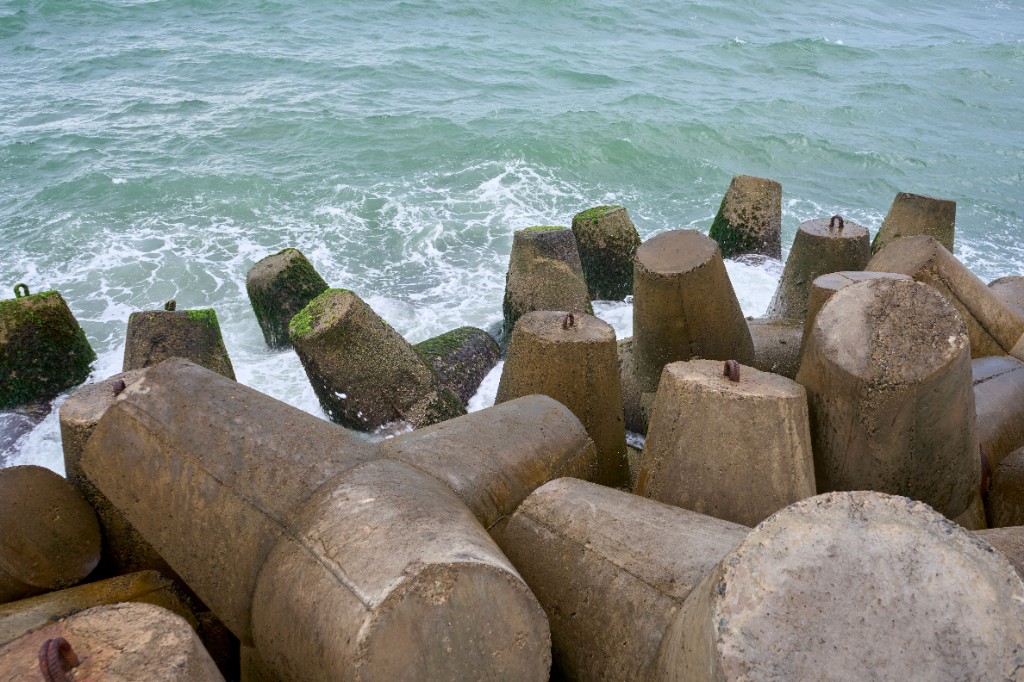 Waves crashing against concrete tetrapods